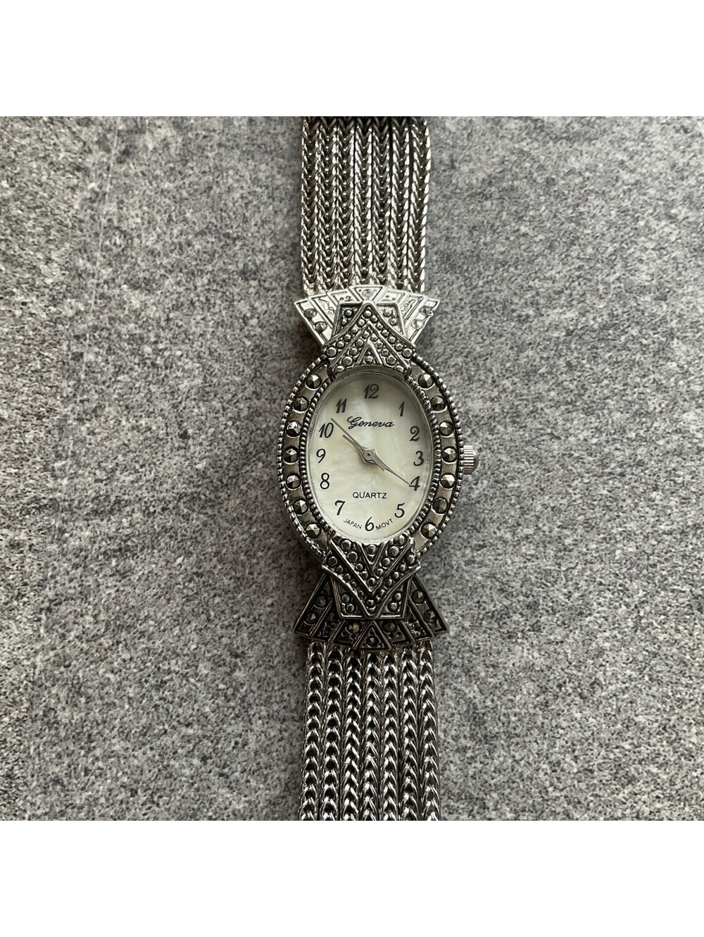 Vintage Geneva Womens Marcasite Watch With Filigree Accents MOP Dial A-7